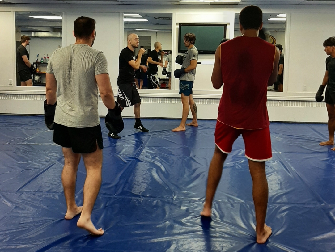 Boxing coach demonstrating technique